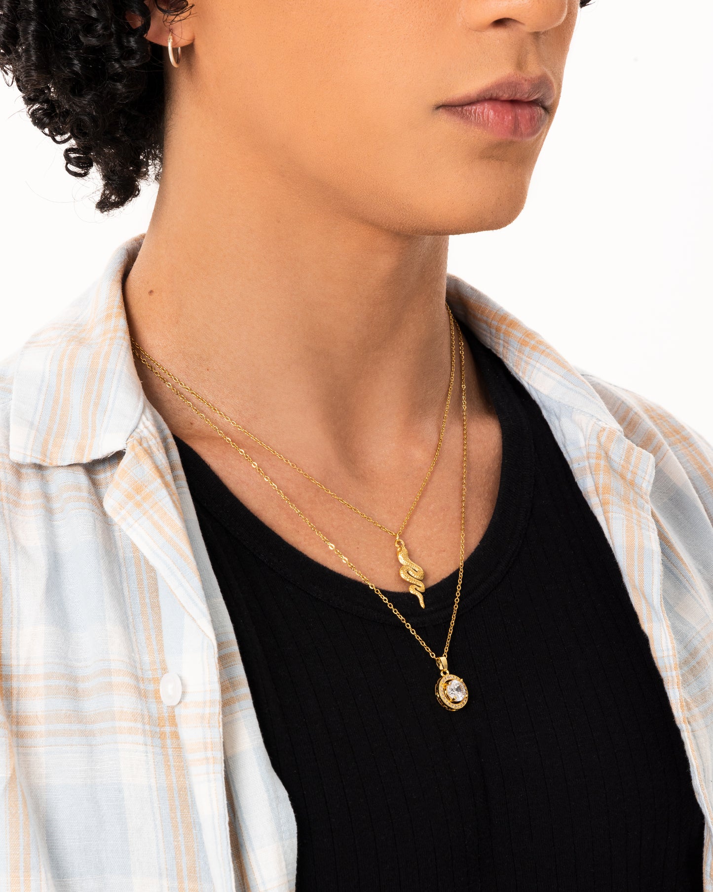 Gold-toned stainless steel necklace featuring a sleek snake design