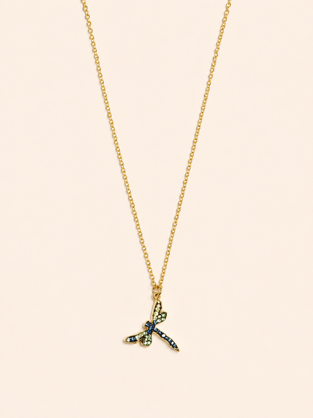 statement gold stainless steel necklace adorned with a Swarovski crystal dragonfly pendant.