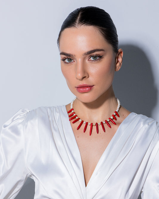 high-quality cultured pearl necklace adorned with elegant red triangle-shaped synthetic stones