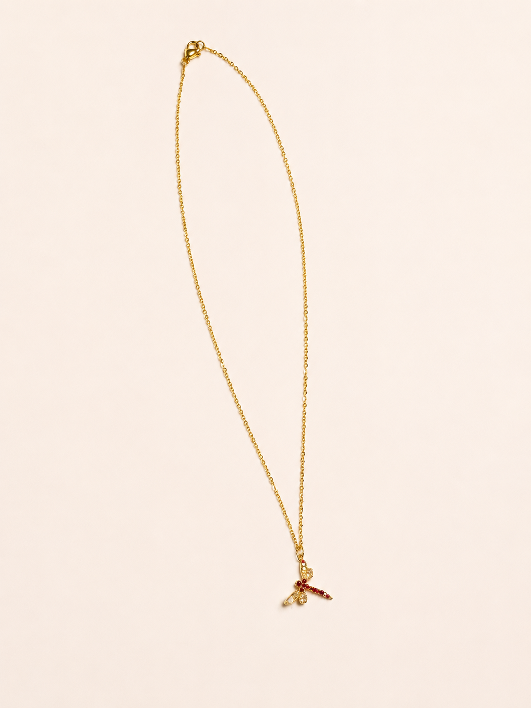 luxurious gold stainless steel necklace featuring a Swarovski crystal dragonfly pendant.