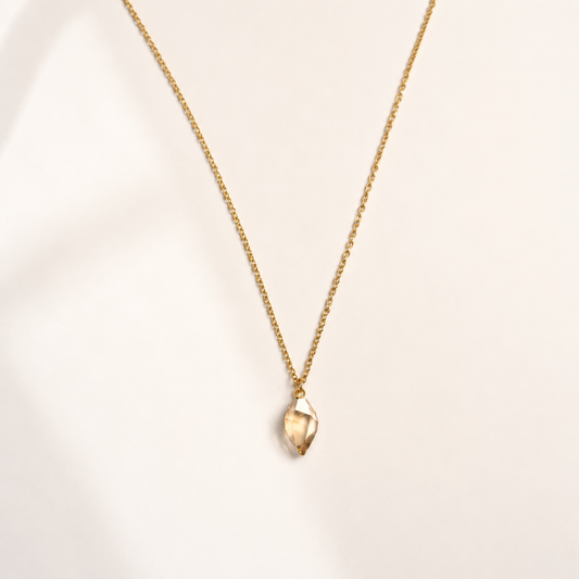 gold stainless steel necklace featuring a luxurious Swarovski crystal in a stunning Shadow Gold shade.