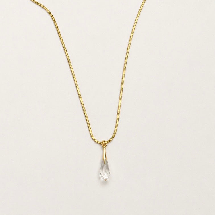 luxurious gold stainless steel necklace featuring a Swarovski crystal pendant.