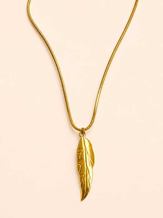 gold stainless steel necklace featuring a delicate leaf-shaped pendant.