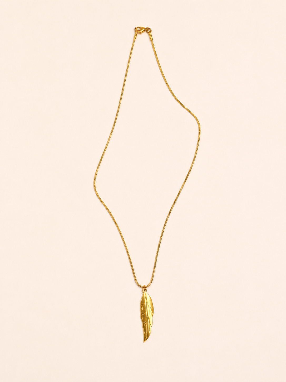 gold stainless steel necklace featuring a delicate leaf-shaped pendant.