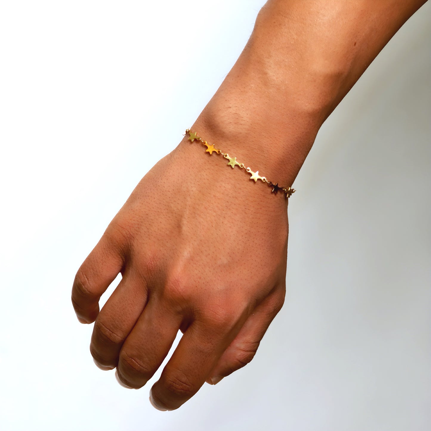 Gold-tone stainless steel bracelet with delicate star design